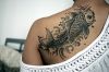 Koi Fish tattoo at girls' back