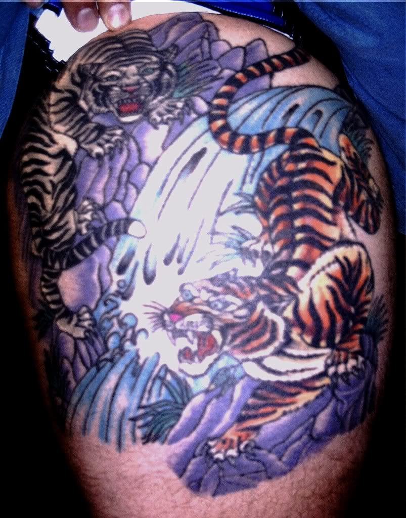 Embrace the untamed beauty of a tiger thigh tattoo concept. With dark white  and orange tones, this hyper-realistic ink captivates with i... | Instagram