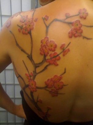 cherry blossom tree tattoo on shoulder blade